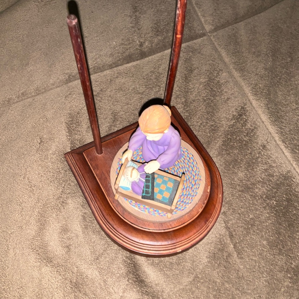 Handcrafted Wooden Figurine with Purple Accents